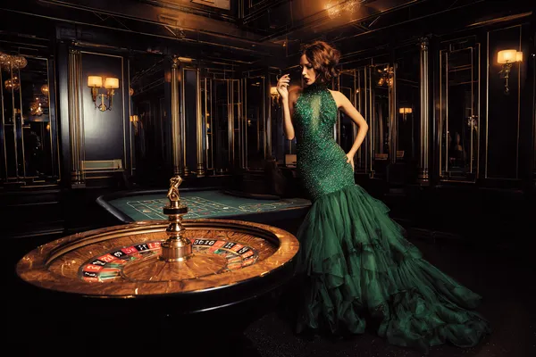 A man focused on his laptop with live stats in the background, highlighting the dedicated sports and gaming features of the BB444 mobile app.