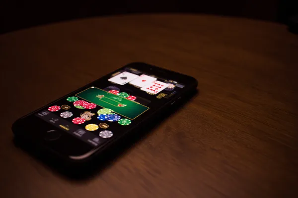 A confident dealer surrounded by casino chips inviting players to access their BB444 account, reflecting quick and easy login options.